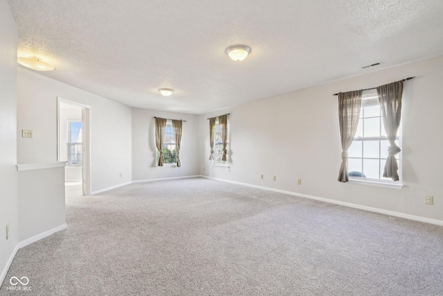 10303 Memorial Knoll Dr, Indianapolis, IN 46234 - carpeted spare room featuring visible vents, a textured ceiling, and baseboards