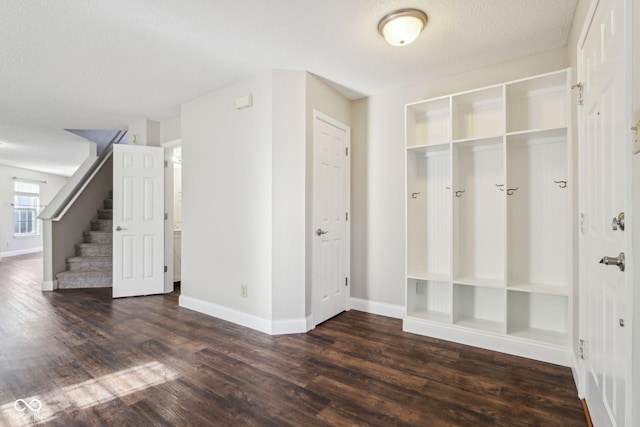 10303 Memorial Knoll Dr, Indianapolis, IN 46234 - mudroom featuring baseboards, a textured ceiling, and wood finished floors