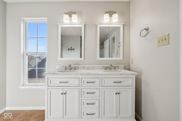 10303 Memorial Knoll Dr, Indianapolis, IN 46234 - bathroom featuring double vanity, a sink, and baseboards