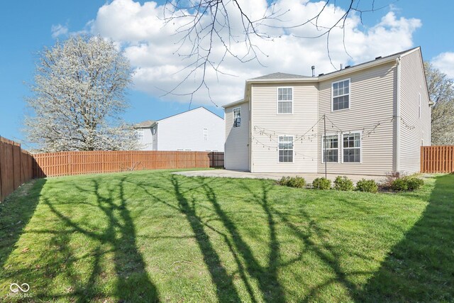 10303 Memorial Knoll Dr, Indianapolis, IN 46234 - back of property with a yard, a fenced backyard, and a patio area