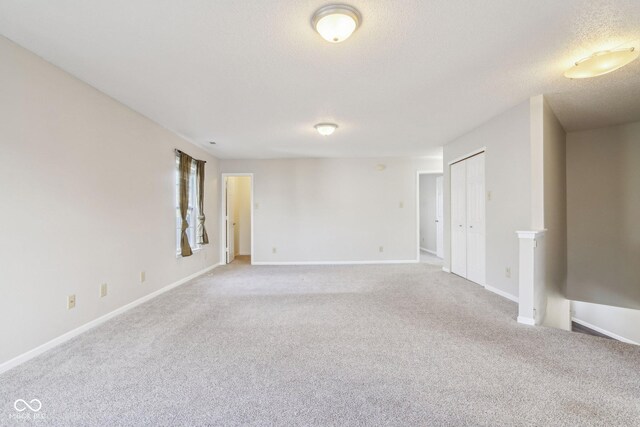 10303 Memorial Knoll Dr, Indianapolis, IN 46234 - carpeted spare room featuring baseboards and a textured ceiling