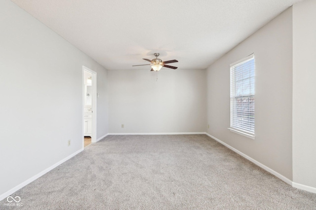 10303 Memorial Knoll Dr, Indianapolis, IN 46234 - carpeted spare room featuring baseboards and a ceiling fan