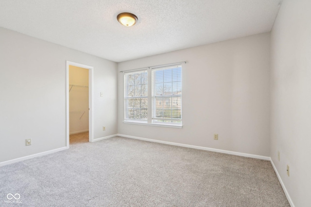 10303 Memorial Knoll Dr, Indianapolis, IN 46234 - unfurnished room with baseboards, carpet flooring, and a textured ceiling