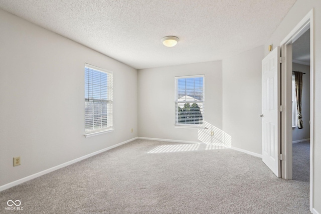10303 Memorial Knoll Dr, Indianapolis, IN 46234 - carpeted spare room with baseboards and a textured ceiling