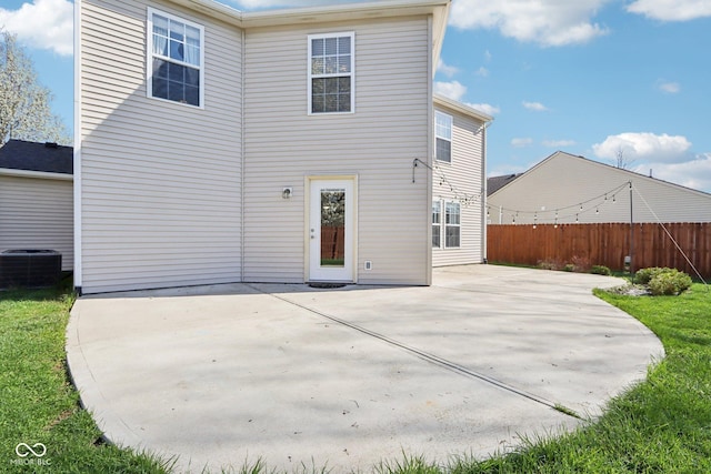 10303 Memorial Knoll Dr, Indianapolis, IN 46234 - back of property with central air condition unit, a patio, and fence