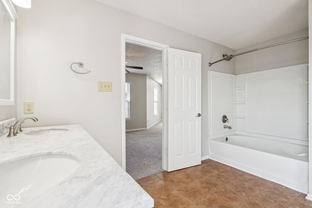 10303 Memorial Knoll Dr, Indianapolis, IN 46234 - bathroom with double vanity, bathtub / shower combination, a sink, and a textured ceiling