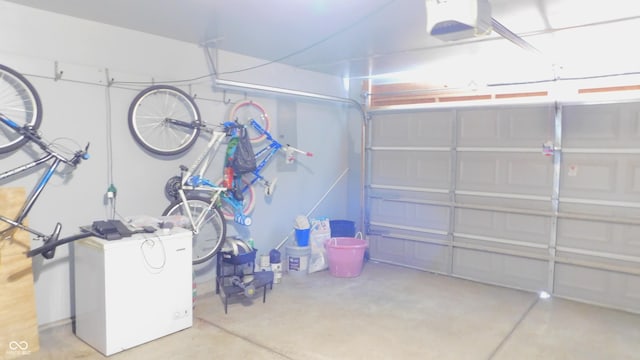 1139 Topp Creek Dr, Indianapolis, IN 46214 - garage featuring a garage door opener