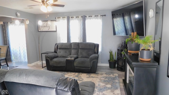 1139 Topp Creek Dr, Indianapolis, IN 46214 - living room featuring a ceiling fan, baseboards, and wood finished floors