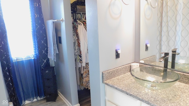 1139 Topp Creek Dr, Indianapolis, IN 46214 - bathroom featuring vanity and wood finished floors