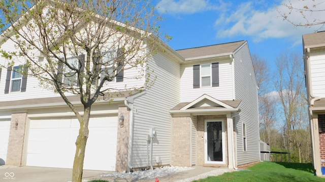 1139 Topp Creek Dr, Indianapolis, IN 46214 - traditional-style house featuring an attached garage, concrete driveway, and roof with shingles