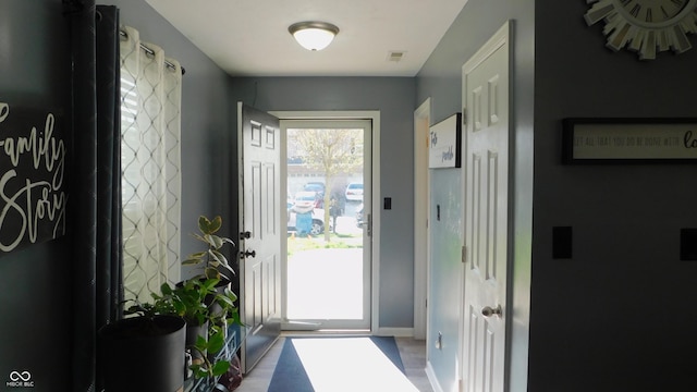 1139 Topp Creek Dr, Indianapolis, IN 46214 - doorway to outside with baseboards and wood finished floors