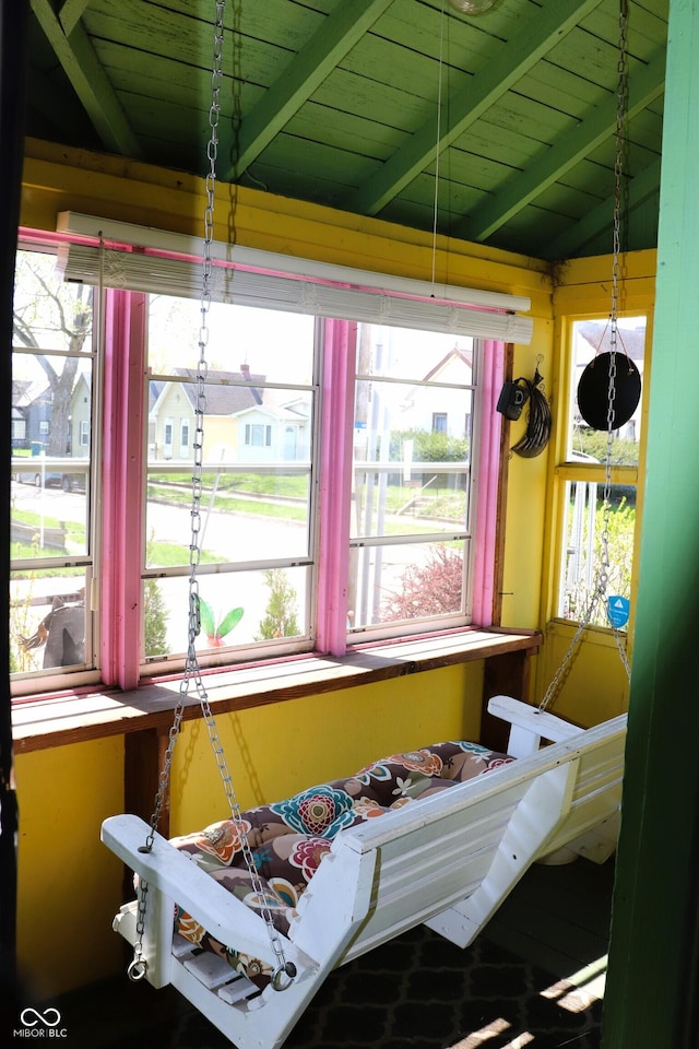 miscellaneous room with lofted ceiling with beams and wood ceiling