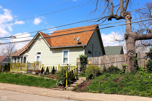 view of property exterior featuring fence