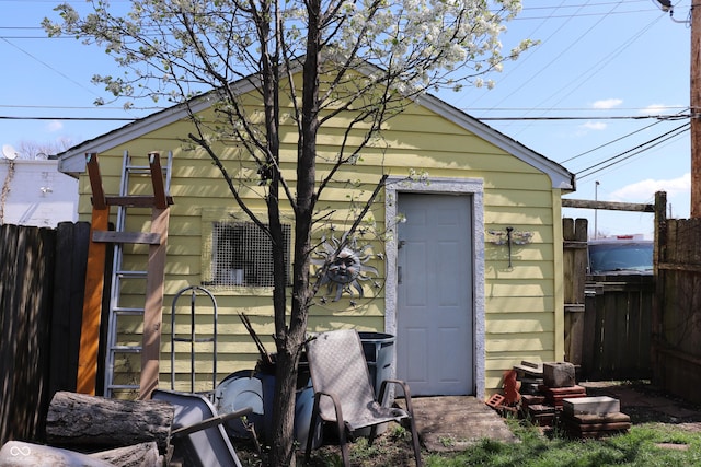 view of outbuilding with an outbuilding and fence