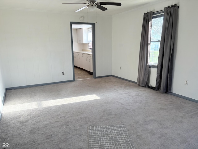 1804 W 15th St, Muncie, IN 47302 - empty room with baseboards, a ceiling fan, and carpet