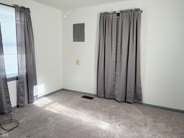 1804 W 15th St, Muncie, IN 47302 - carpeted spare room featuring visible vents, baseboards, and electric panel