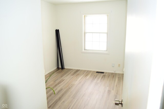 4107 Eisenhower Dr, Indianapolis, IN 46254 - unfurnished room with visible vents, baseboards, and light wood-style floors