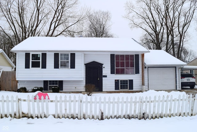 4107 Eisenhower Dr, Indianapolis, IN 46254 - raised ranch with an attached garage and fence