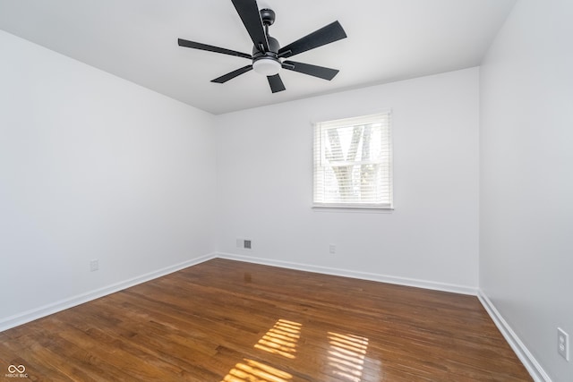 4106 Armon Ct, Carmel, IN 46033 - spare room featuring visible vents, baseboards, ceiling fan, and wood finished floors