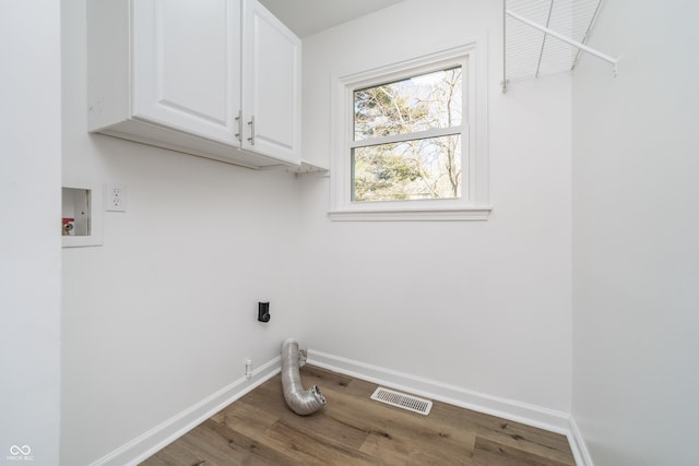 4106 Armon Ct, Carmel, IN 46033 - laundry area with visible vents, wood finished floors, hookup for an electric dryer, washer hookup, and cabinet space