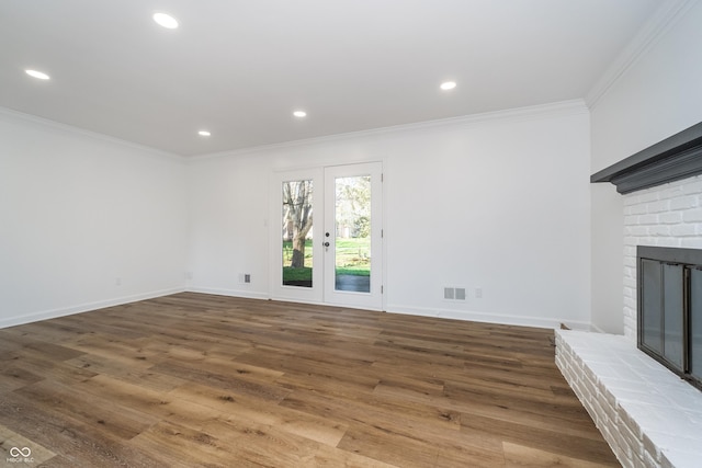 4106 Armon Ct, Carmel, IN 46033 - unfurnished living room featuring ornamental molding, visible vents, wood finished floors, and a fireplace
