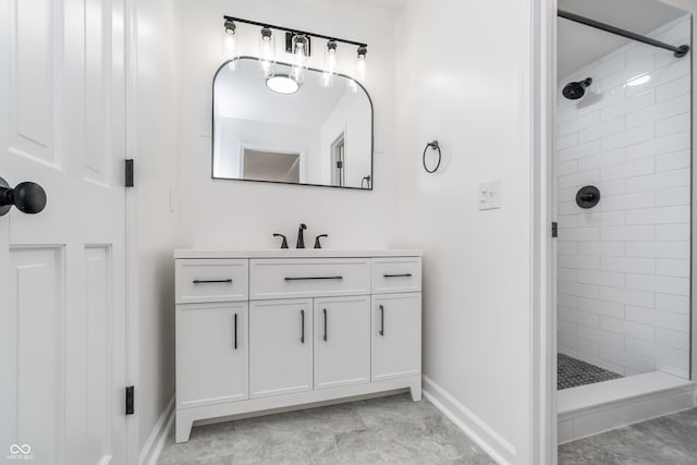 4106 Armon Ct, Carmel, IN 46033 - bathroom featuring tiled shower, vanity, and baseboards