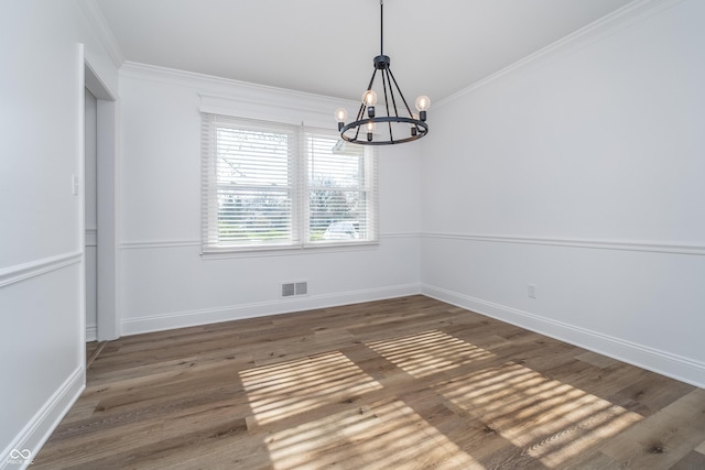 4106 Armon Ct, Carmel, IN 46033 - unfurnished dining area featuring a chandelier, visible vents, crown molding, and wood finished floors