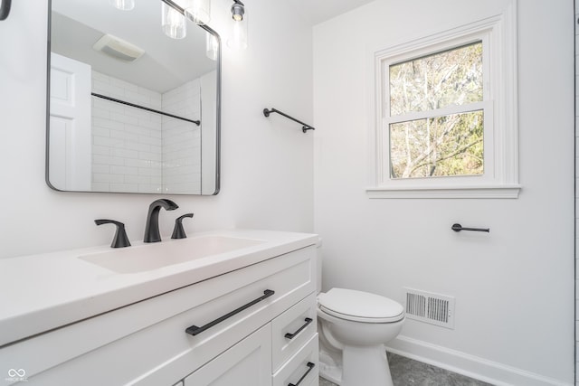 4106 Armon Ct, Carmel, IN 46033 - bathroom with visible vents, toilet, vanity, and baseboards
