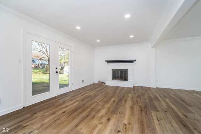 4106 Armon Ct, Carmel, IN 46033 - unfurnished living room featuring wood finished floors, ornamental molding, and a brick fireplace