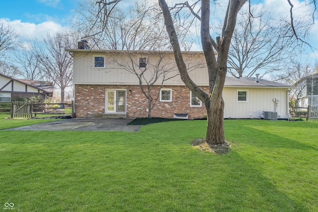 4106 Armon Ct, Carmel, IN 46033 - back of property featuring a chimney, a patio area, brick siding, a yard, and fence
