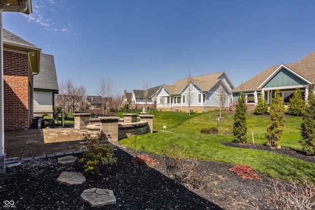 528 Dylan Dr, Carmel, IN 46032 - view of green lawn with a patio and a residential view