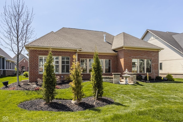 528 Dylan Dr, Carmel, IN 46032 - back of property featuring brick siding, a yard, and roof with shingles