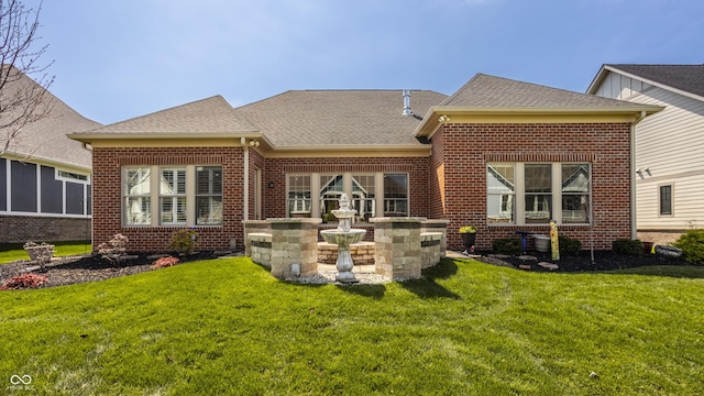 528 Dylan Dr, Carmel, IN 46032 - back of property featuring brick siding, a lawn, and roof with shingles