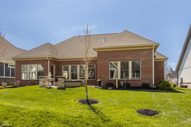 528 Dylan Dr, Carmel, IN 46032 - back of property with brick siding, a yard, and a shingled roof