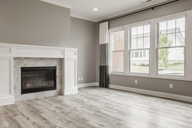 528 Dylan Dr, Carmel, IN 46032 - unfurnished living room featuring ornamental molding, light wood-style floors, a fireplace, baseboards, and recessed lighting