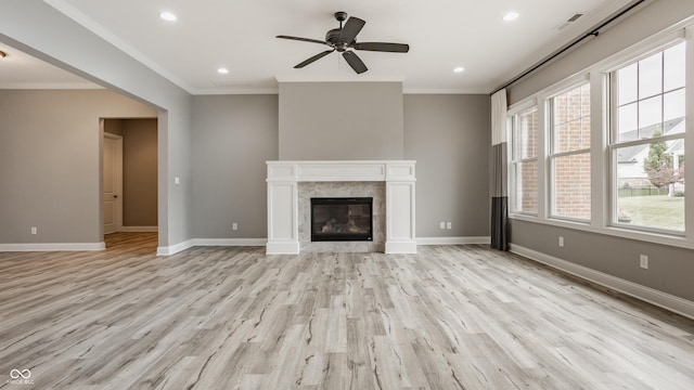 528 Dylan Dr, Carmel, IN 46032 - unfurnished living room featuring light wood finished floors, crown molding, recessed lighting, ceiling fan, and baseboards
