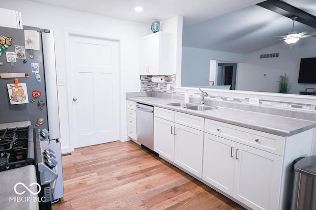8917 N Old State Road 37, Bloomington, IN 47408 - kitchen featuring a sink, light wood-type flooring, a ceiling fan, stainless steel appliances, and decorative backsplash