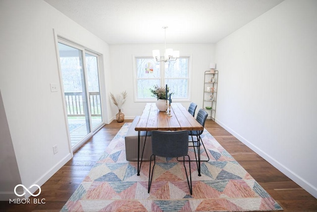 8917 N Old State Road 37, Bloomington, IN 47408 - dining room featuring a notable chandelier, baseboards, and wood finished floors