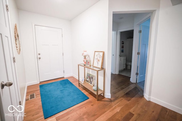 8917 N Old State Road 37, Bloomington, IN 47408 - foyer featuring visible vents, baseboards, and wood finished floors