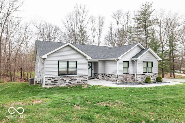 8917 N Old State Road 37, Bloomington, IN 47408 - view of front of home featuring stone siding, roof with shingles, and a front yard