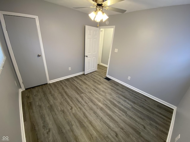 1546 Kappes St, Indianapolis, IN 46221 - unfurnished bedroom featuring wood finished floors, ceiling fan, baseboards, and visible vents