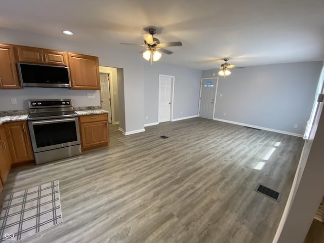 1546 Kappes St, Indianapolis, IN 46221 - kitchen featuring light wood-type flooring, appliances with stainless steel finishes, baseboards, and a ceiling fan