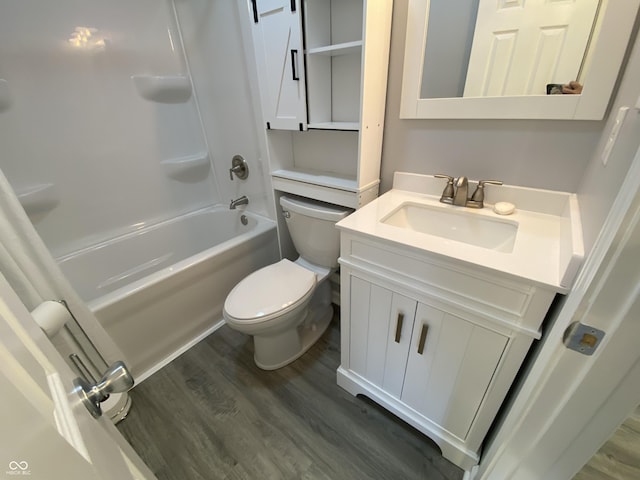 1546 Kappes St, Indianapolis, IN 46221 - full bath with toilet, wood finished floors, vanity, and tub / shower combination
