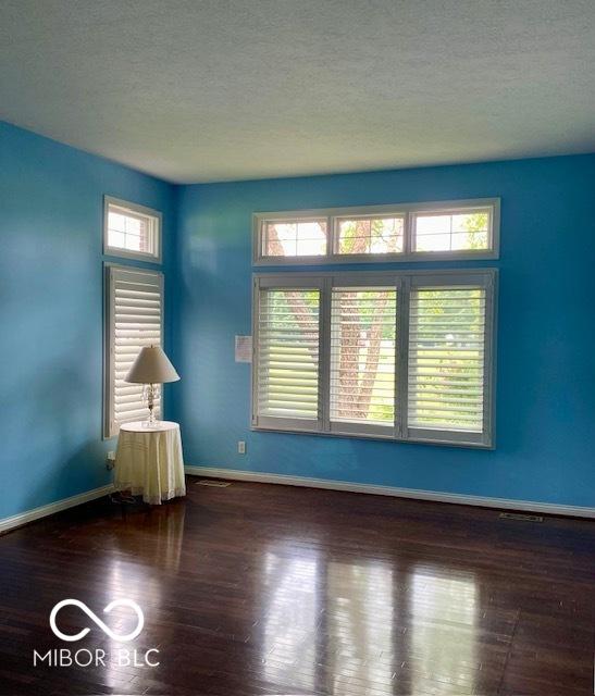 3504 Inverness Blvd, Carmel, IN 46032 - empty room featuring wood finished floors, baseboards, and a textured ceiling