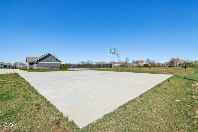 view of sport court with community basketball court and a lawn
