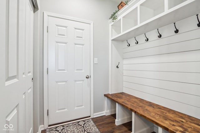 mudroom with baseboards and dark wood finished floors