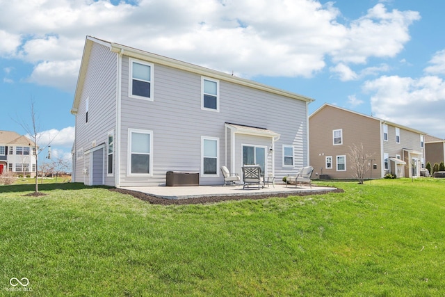 rear view of house with a patio and a yard