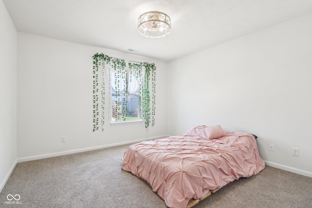 bedroom featuring visible vents, baseboards, and carpet floors