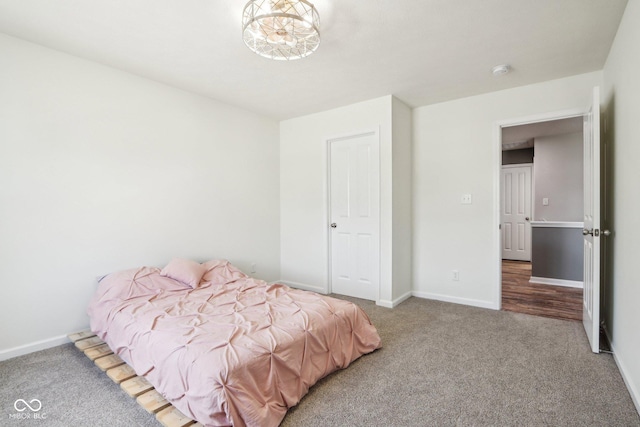 bedroom with carpet floors and baseboards