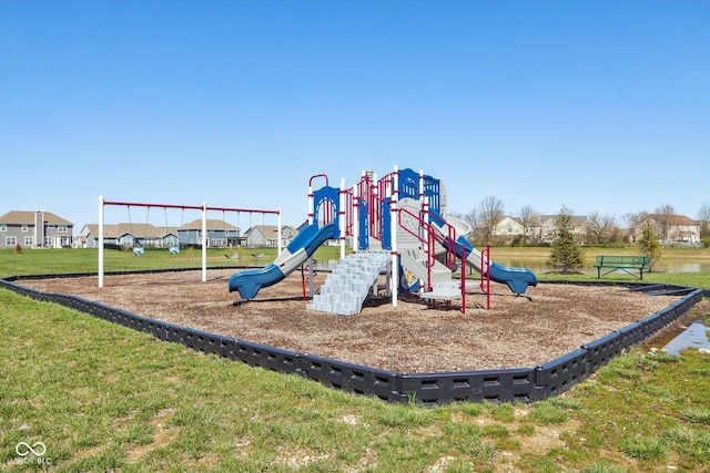 community jungle gym with a yard
